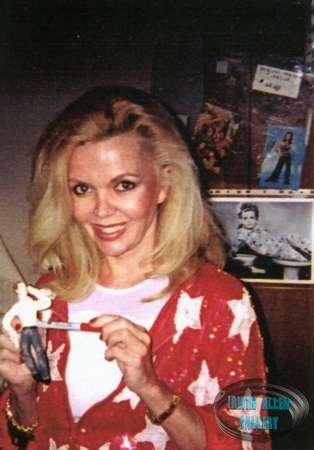 Deanna Lund with miniature Land of the Giants Mark Wilson figure