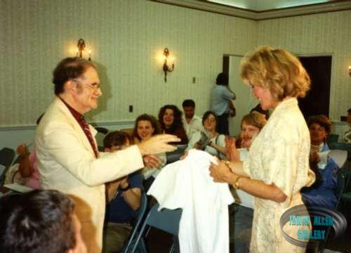 Dr. Fred presents Deanna Lund with a RoVaCon T-shirt in 1990