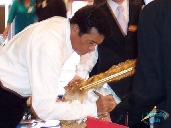 Don Marshall signs the event mirror