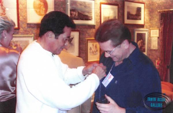 Don Marshall Pins Climbing Rope to Colin's Shirt