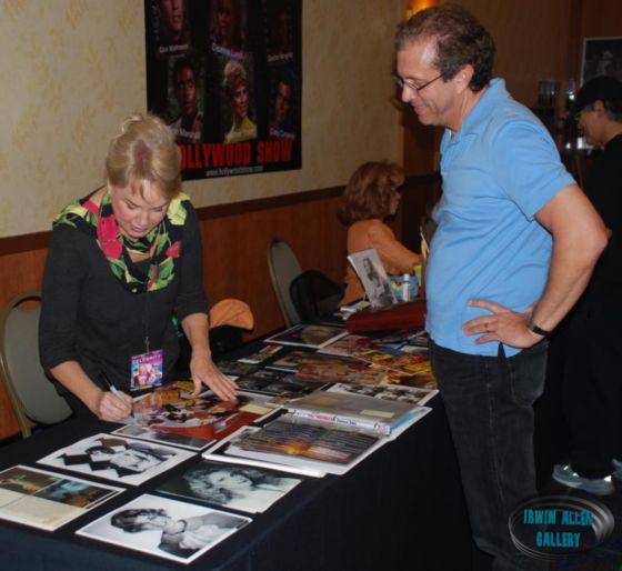 Heather Young signs photo for Kirk