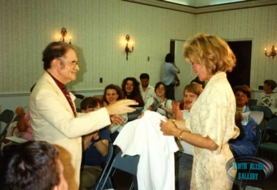 Dr. Fred presents T-Shirt to Deanna Lund