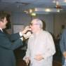 Riley feeds the Chief as Kowalski watches