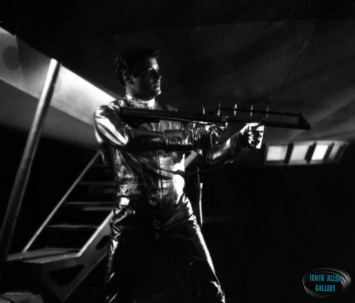 John Robinson holding laser rifle