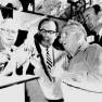 Irwin Allen examining dinosaur model