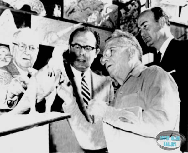 Irwin Allen examining dinosaur model