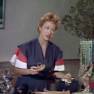 Anne Dore - Woman at Hotel Shop