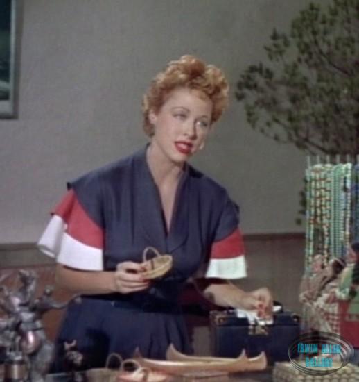 Anne Dore - Woman at Hotel Shop