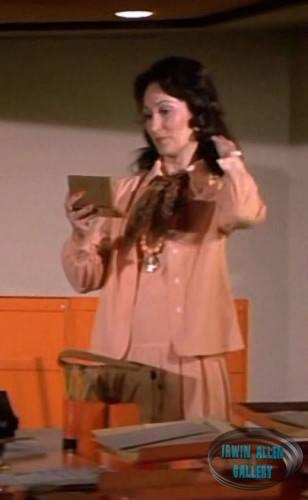Jennifer Rhodes - Janet, Secretary