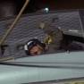 Man Firing Line from Helicopter