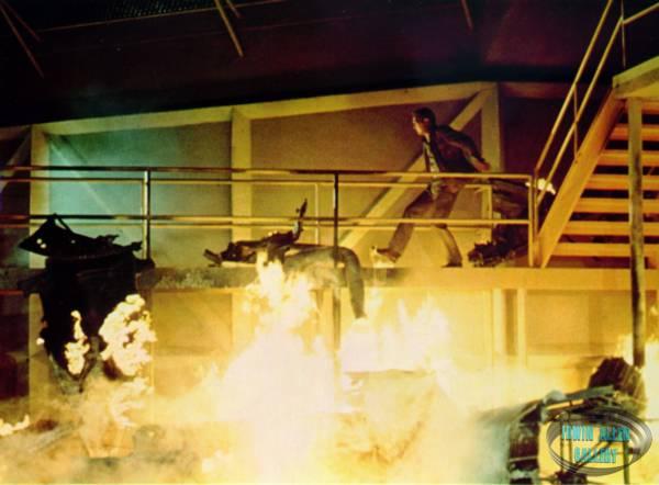 Paul Newman amongst burnt wreckage