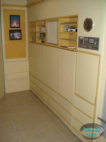 Stateroom With Bed and Desk Folded Up