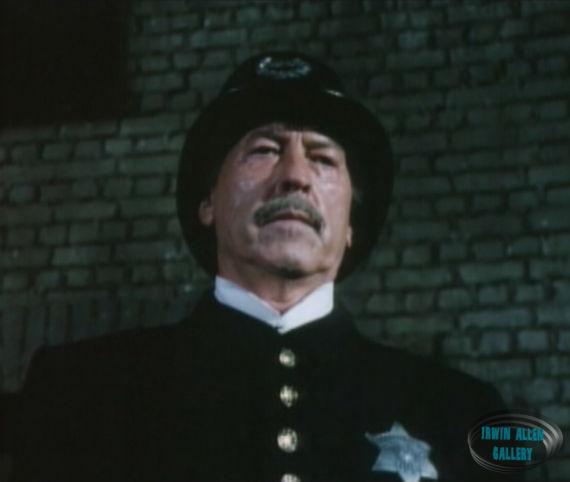 Policeman who catches Adams with Sharkey